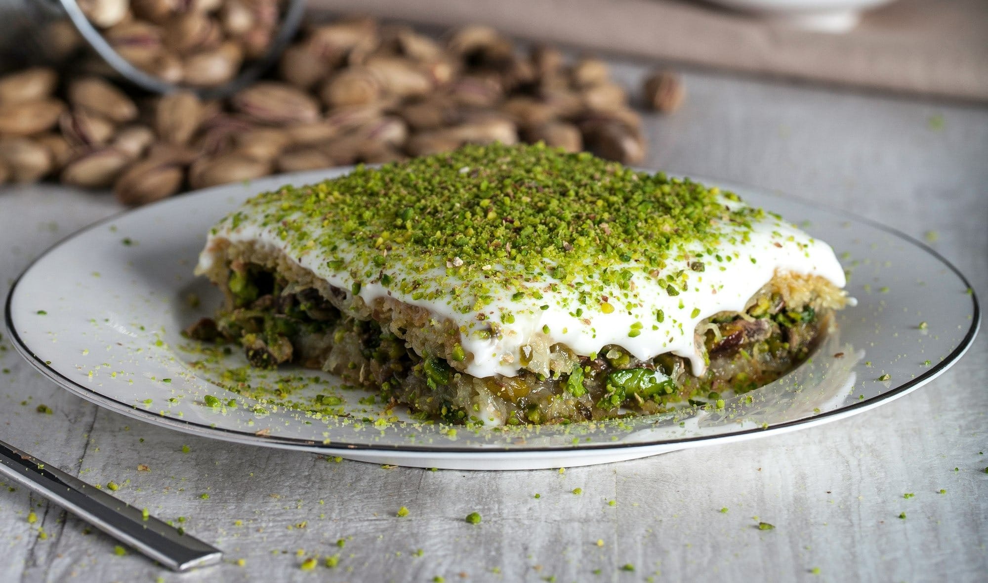 Pistachio Kadayif on white ceramic plate