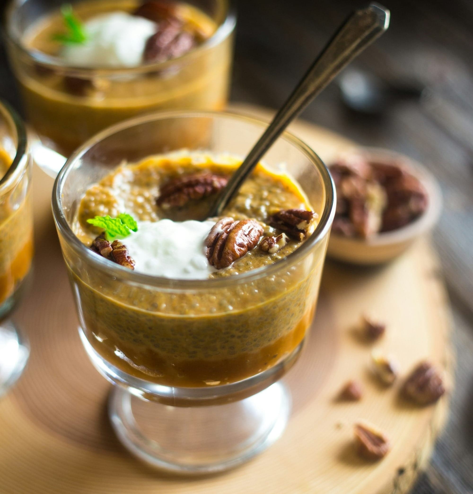 selective focus photography of clear sorbet glass filled with dessert