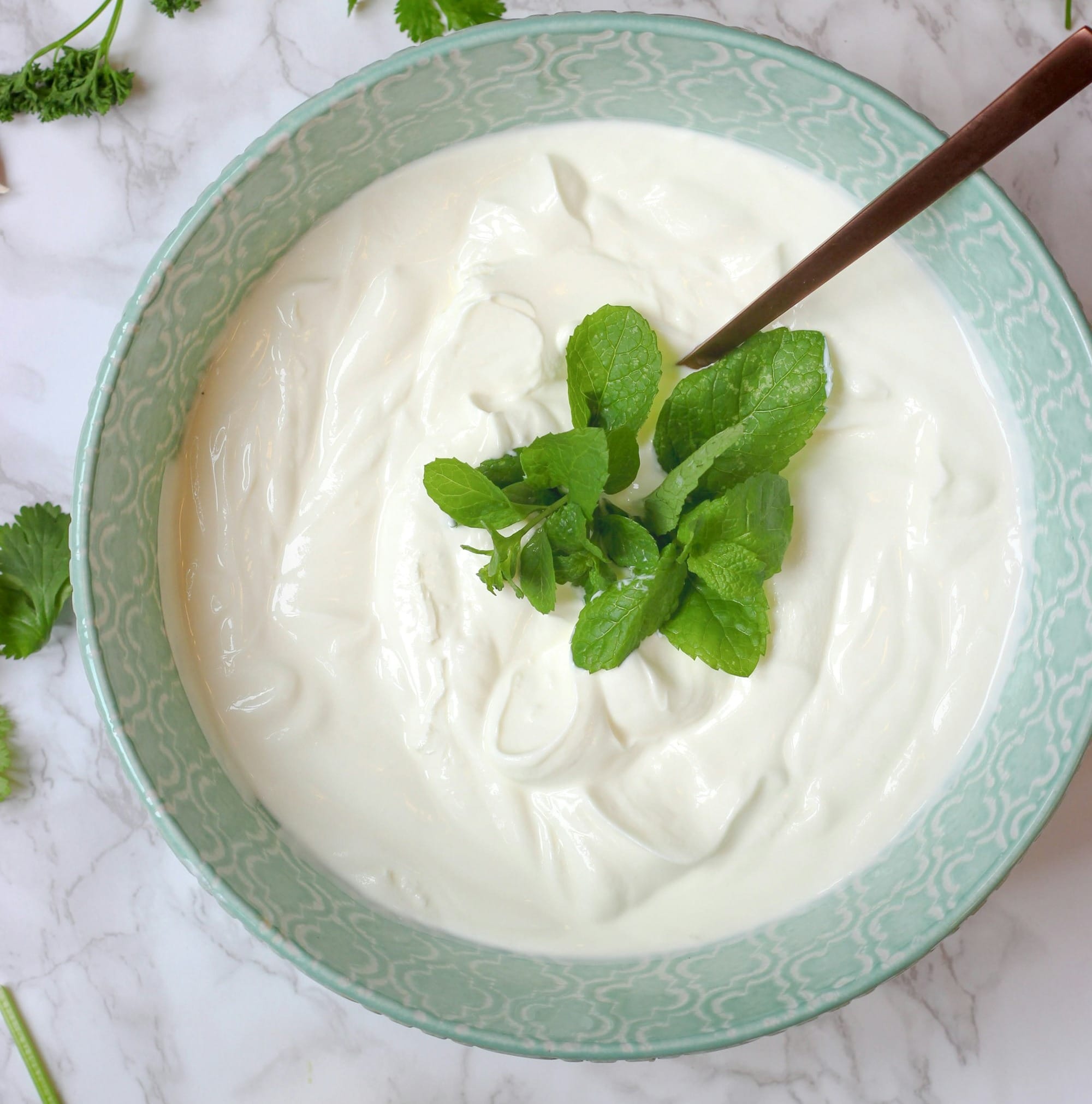 a bowl of yogurt with a spoon in it